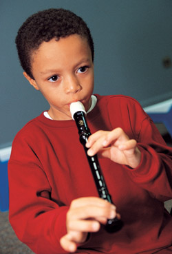 Boy playing recorder